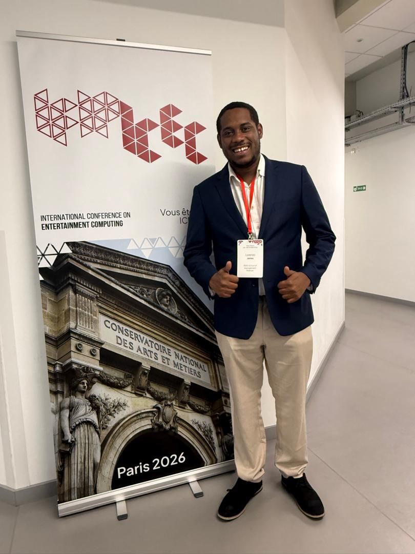 Lorenzo giving a thumbs up next to the ICEC Paris 2026 banner